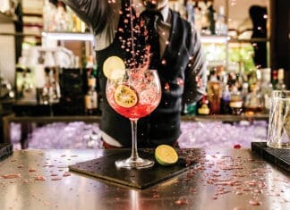 Barman Is Making Cocktail At Night Club.