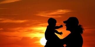 Mother And Baby At Sunset