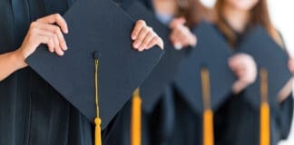 Close Up Group Of Graduates Holding A Hat At The Graduation Ceremony At The University