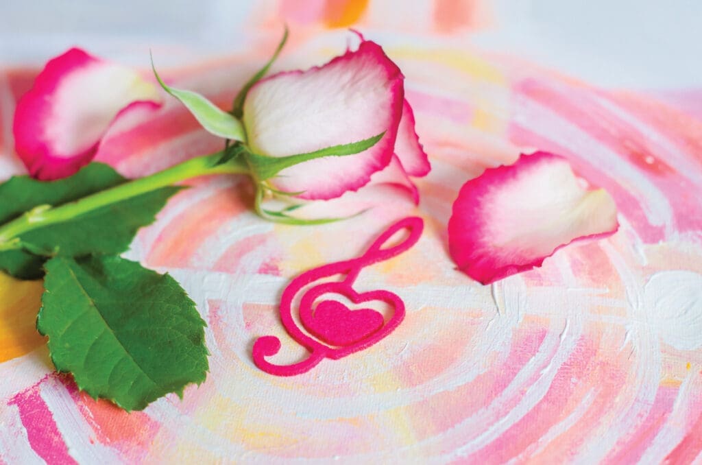 Rose With A Decorative Heart In The Shape Of A Treble Clef With Pink Felt.