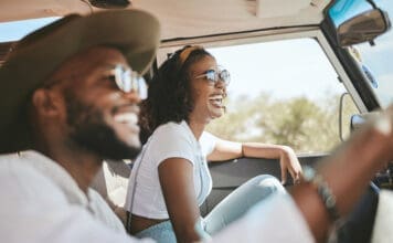 Travel, Road Trip And Black People Couple Driving By Countryside For Holiday, Journey And Freedom With Happiness. Trendy Sunglasses, Fashion And Gen Z Friends In A Car Drive For Vacation Lifestyle
