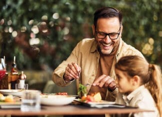 The Modern Men’s Health Conversation Father And Daughter Laughing Over Lunch At Outdoor Restaurant Patio, Family Dining And Bonding